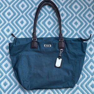 Tumi Blue Tote Bag with Leather Handles and Silver Accents